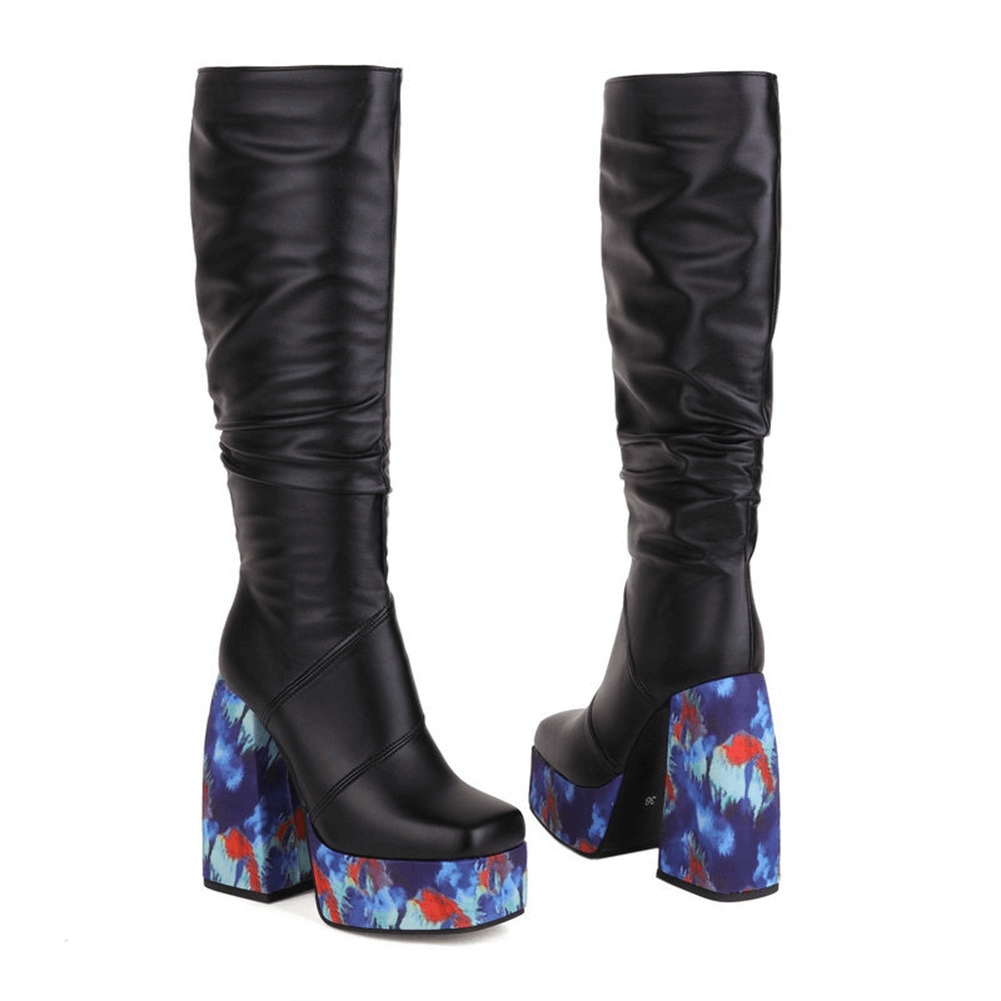 Trendy black high knee zip boots with blue floral platform heels, perfect for a chic casual look.