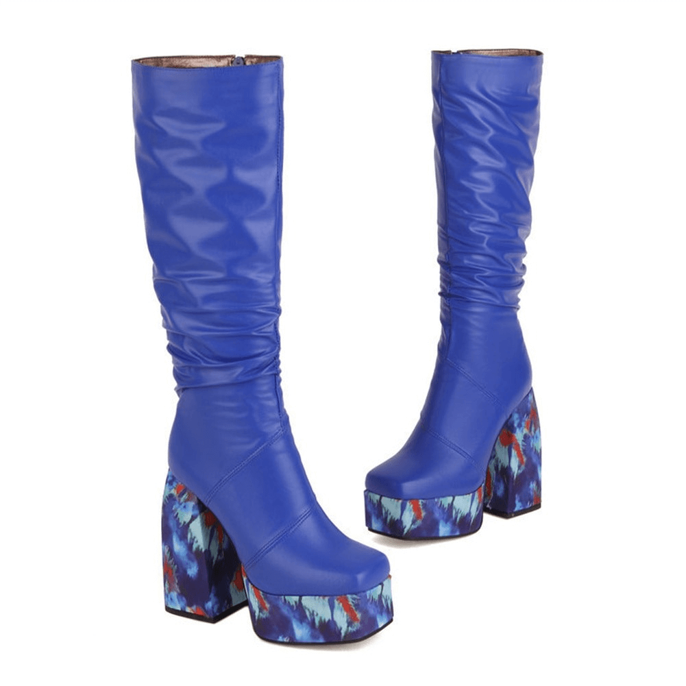 Blue high-knee platform zip boots with colorful soles, perfect trendy footwear for a stylish casual look.