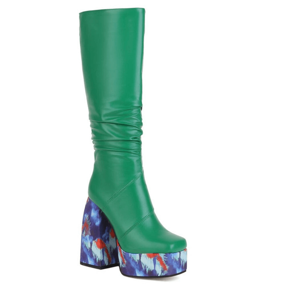 Trendy green platform knee-high boots with colorful patterned soles for stylish casual looks.