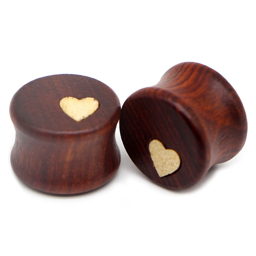 Wood plugs and tunnels earrings stretcher featuring heart design, perfect for body piercing and alternative fashion accessories.