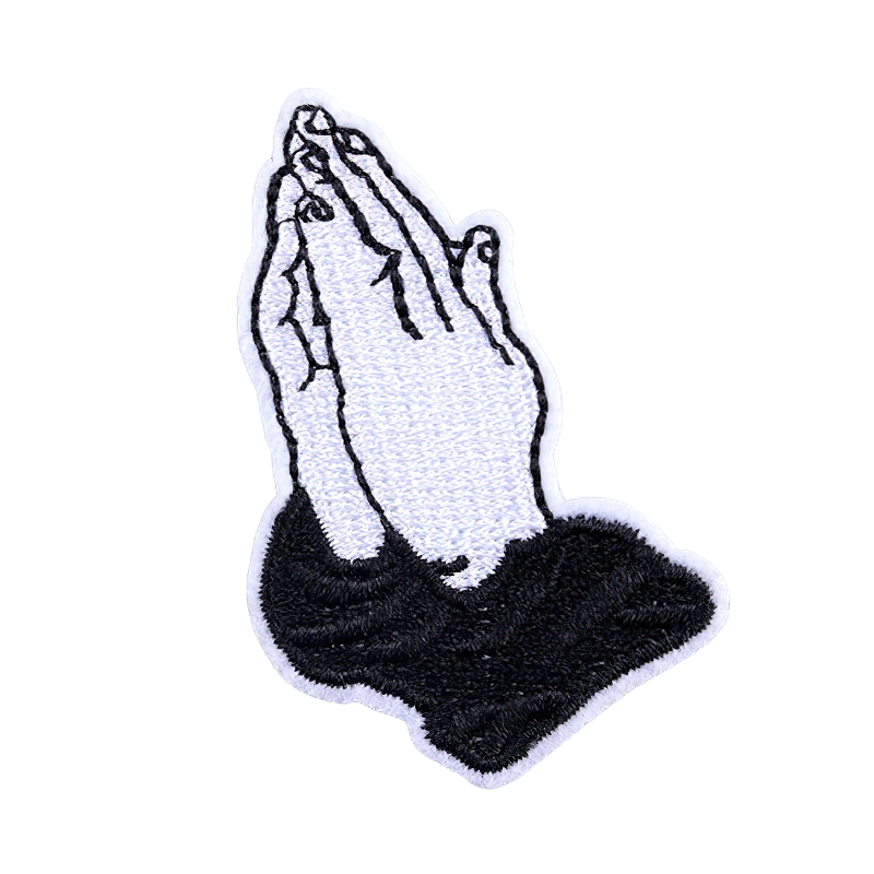 Stylish embroidered 'Praying Hands' patch for clothing, perfect as a unisex alternative accessory.