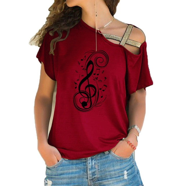 Women in a red musical note graphic T-shirt with treble clef design and trendy hollow shoulder style.