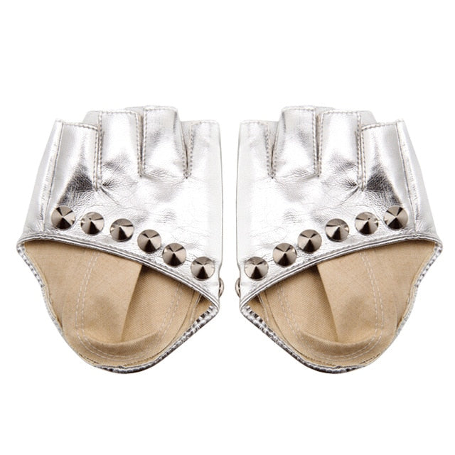 Stylish silver fingerless gloves with rivets for women, perfect for punk rock and alternative fashion outfits.