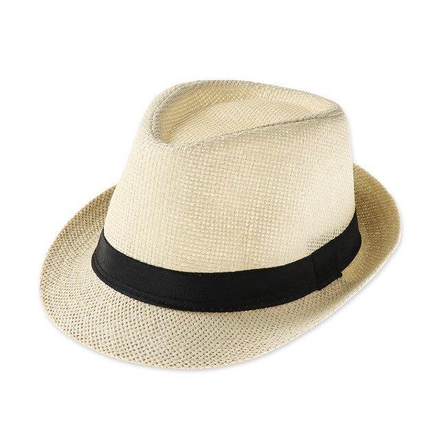 Vintage jazz cap in straw with black ribbon, perfect for summer stage performances and casual outings.