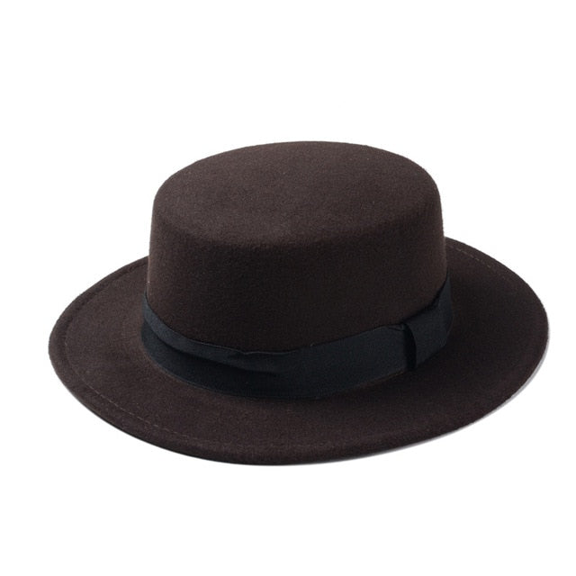 Wide brim gambler hat in dark brown with a flat top and black ribbon, perfect for adding unique style to any outfit.
