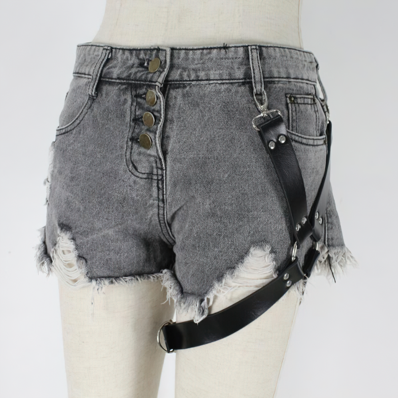 Stylish PU leather belt harness worn over trendy gray denim shorts for a bold fashion statement.