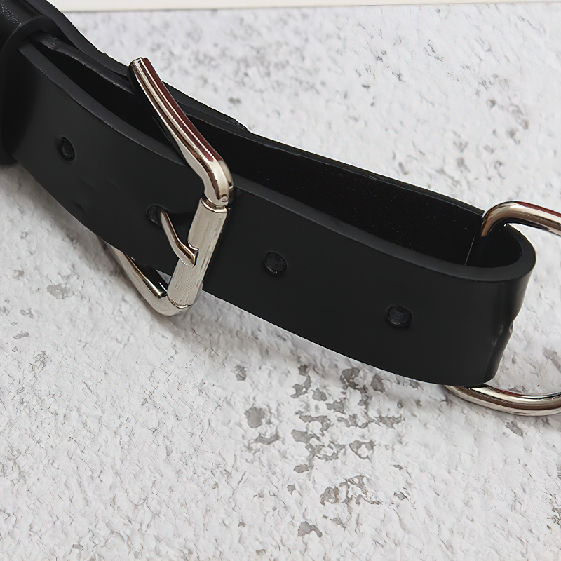 Close-up of a black PU leather belt featuring a stylish metal chain buckle, perfect for alternative fashion outfits.