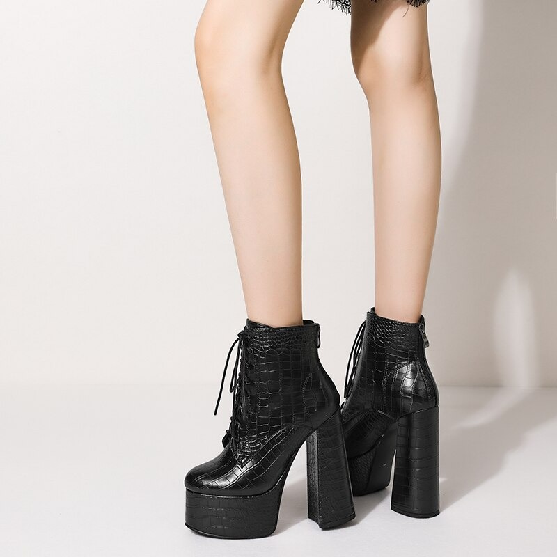 Women’s PU Leather ankle boots with high square heels and lace-up design, perfect for casual style.
