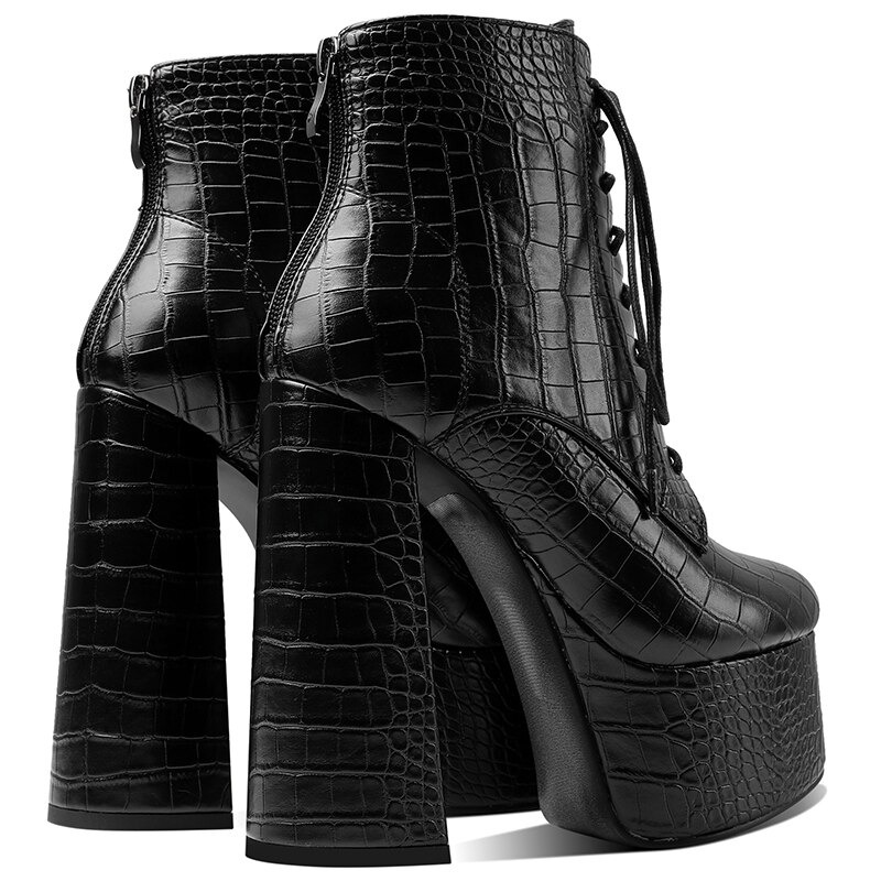 Stylish black PU leather ankle boots with high square heels and round toe design, perfect for casual occasions.