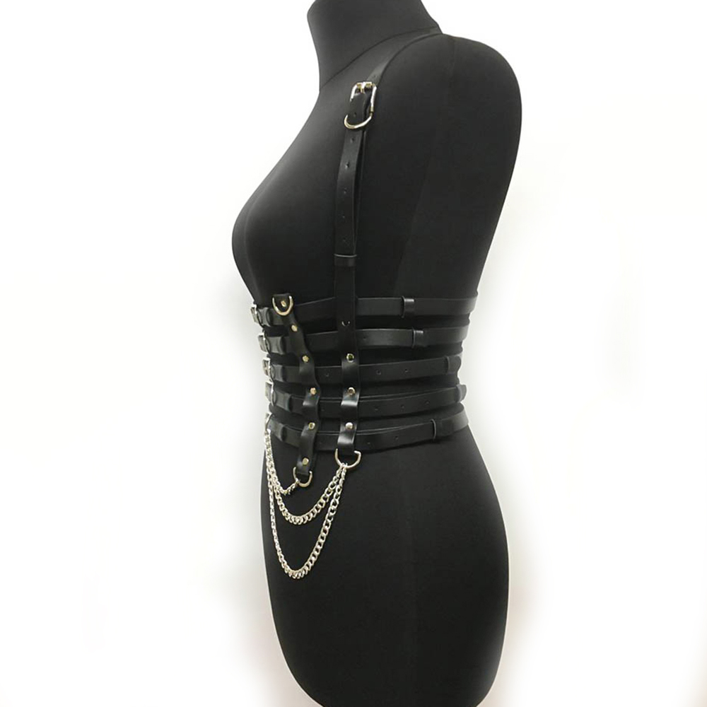 Black PU leather chest harness with silver fittings and chains on mannequin, sexy punk-style accessory for women.