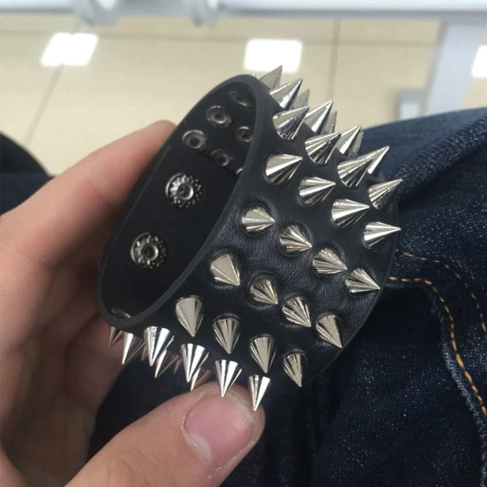 Unisex black PU leather gothic bracelet with four rows of silver spikes, perfect for punk and gothic outfits.
