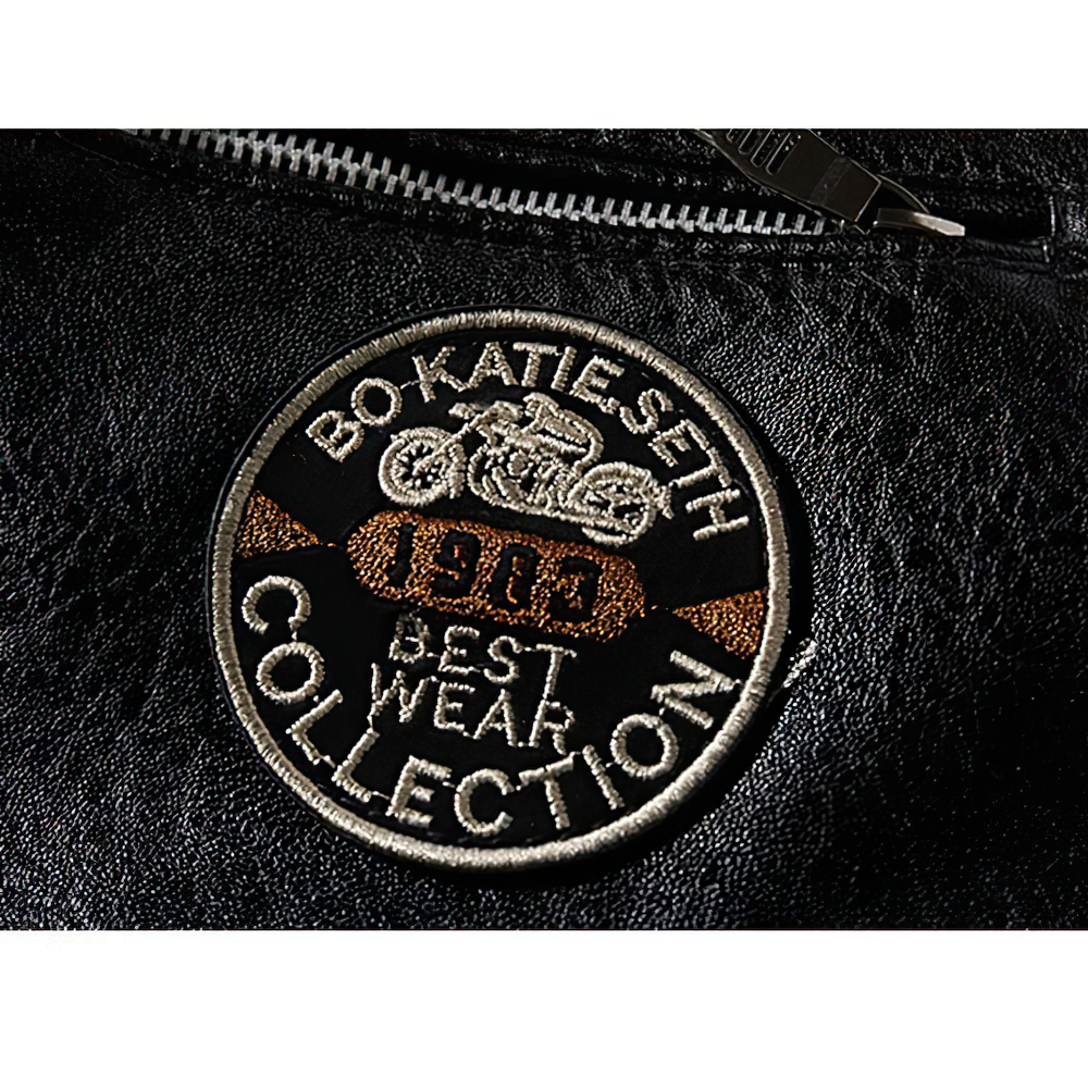 Close-up of a black PU leather jacket patch featuring motorcycle design and 'Best Wear Collection' text.