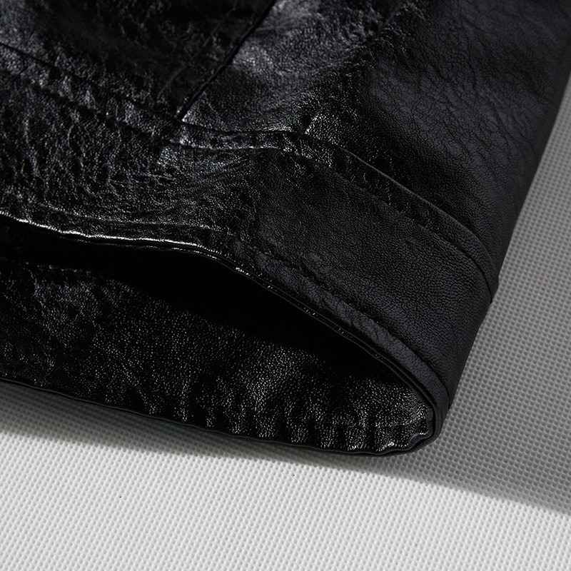 Close-up of the sleeve of a stylish PU leather men's biker jacket in sleek black.