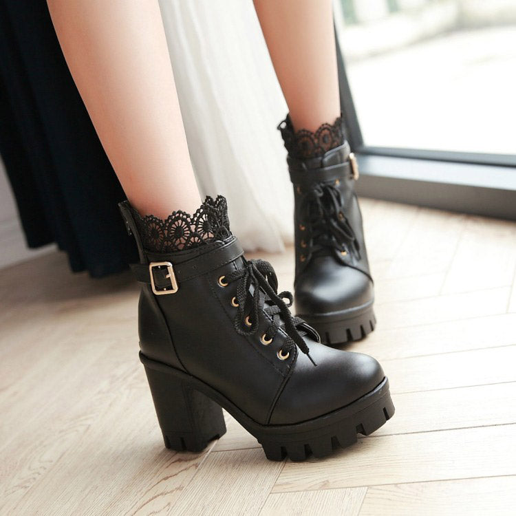 Stylish black lace-up platform ankle boots with decorative lace trim and metal buckle, ideal for gothic outfits.