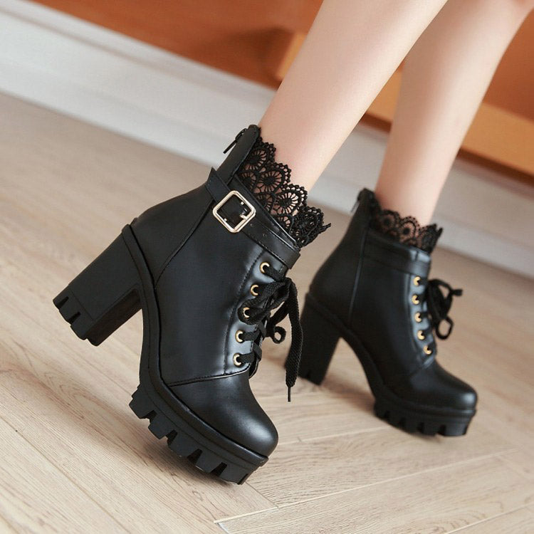 Stylish black platform ankle boots with lace trim and metal buckle, perfect for gothic outfits and winter fashion.