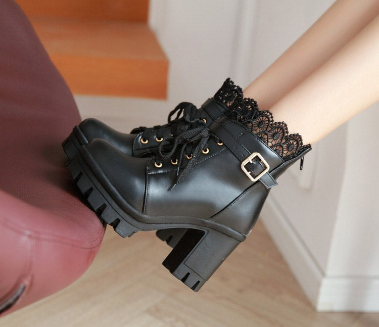 Stylish black lace-up platform ankle boots for women with a buckle, perfect for gothic outfits.
