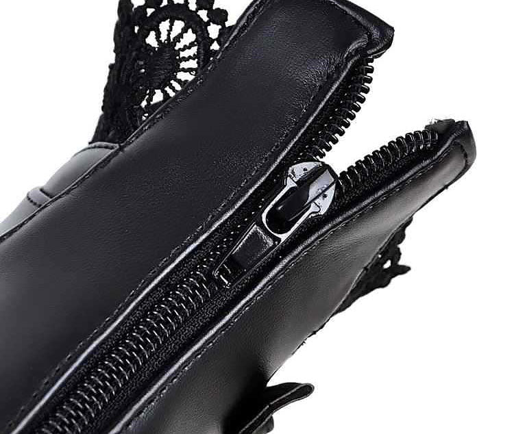 Close-up of the zipper detail on gothic style black leather women's boots.