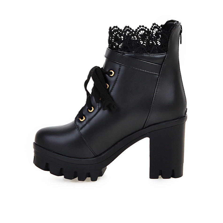 Gothic style black PU leather ankle boots with lace detail and sturdy platform heel, perfect for winter outfits.