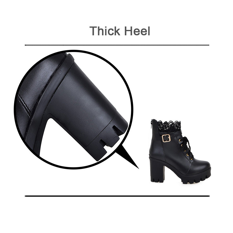 Close-up of thick heel on gothic style black lace-up women's boots with ornate details and chunky design.