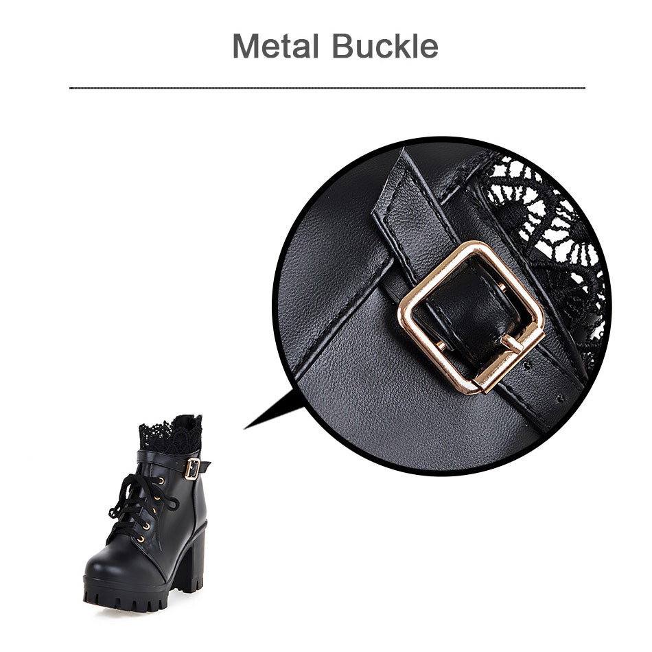 Close-up of black gothic women's lace-up boots featuring a stylish metal buckle and intricate lace design.