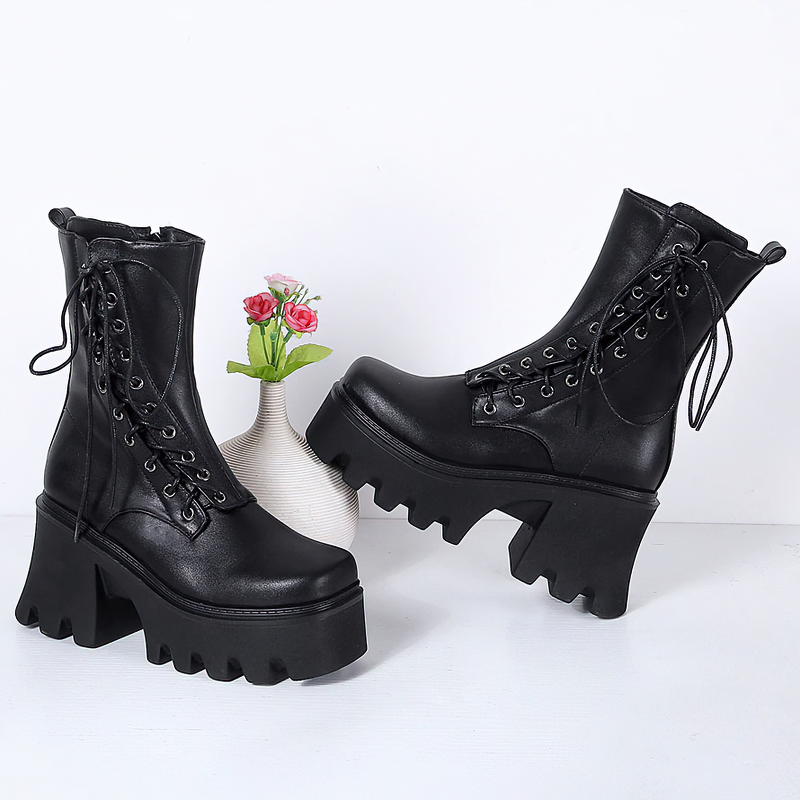 Stylish black PU leather ankle boots with lace up design and high tractor soles for a gothic look.