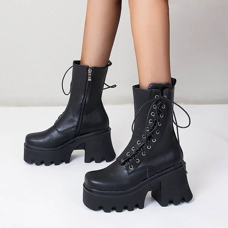 Trendy black PU leather women's lace-up boots with high tractor soles, perfect for a stylish gothic look.
