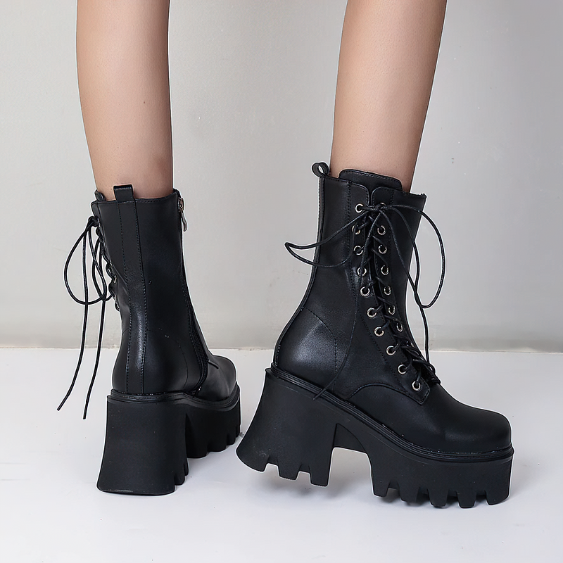 Stylish women's black PU leather gothic boots with lace-up design and high tractor soles.