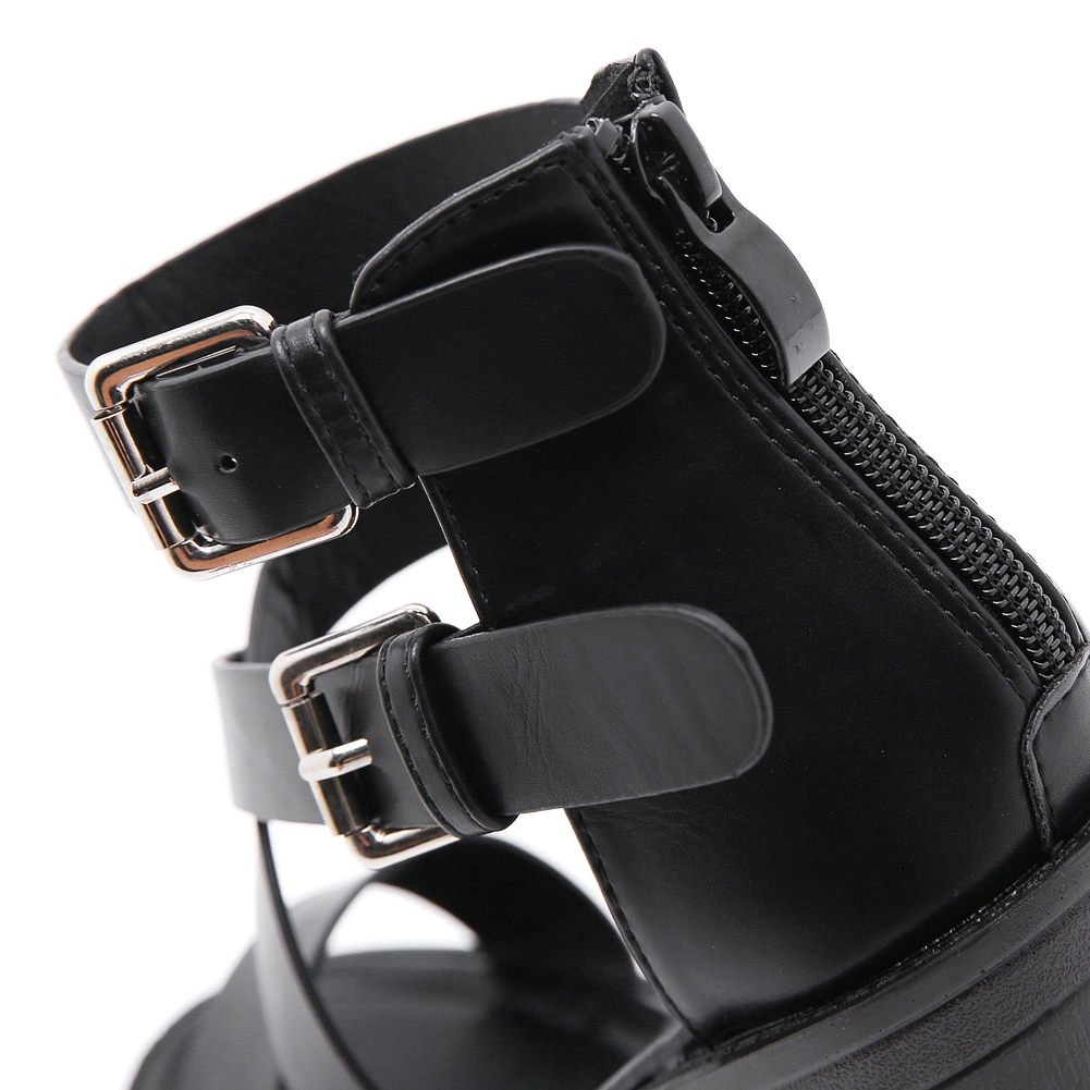 Close-up of black PU leather women's high heel sandals featuring dual straps and a stylish zipper detail.