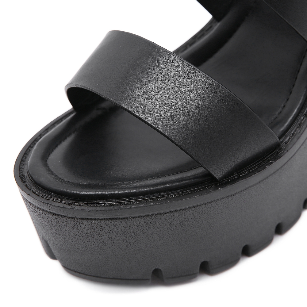 Close-up of stylish black PU leather high heel sandals with platform design, perfect for a trendy gothic look.