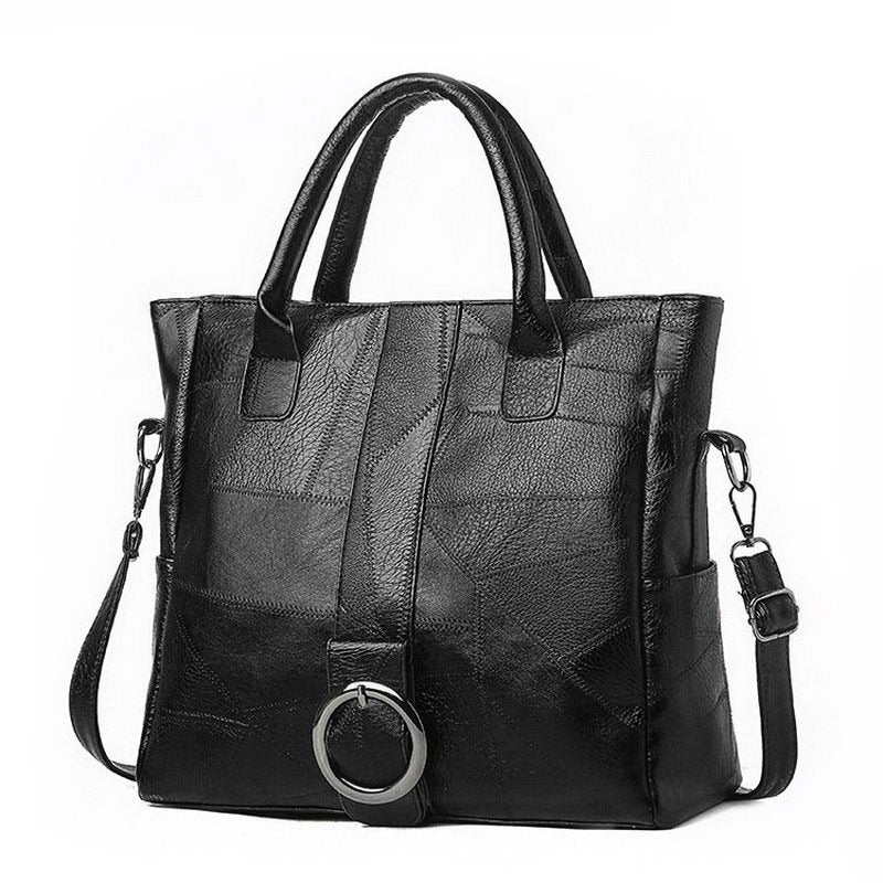 Black PU leather women's retro handbag with a stylish ring detail, perfect for travel and everyday use.