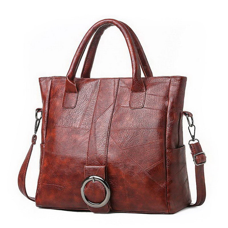 Stylish brown PU leather women's retro handbag with a central ring and dual carry options for travel and everyday use.