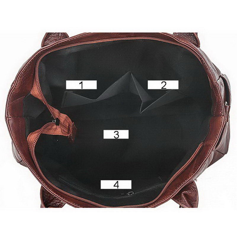 Interior view of a brown pu leather handbag with multiple pockets for organized storage and travel convenience.