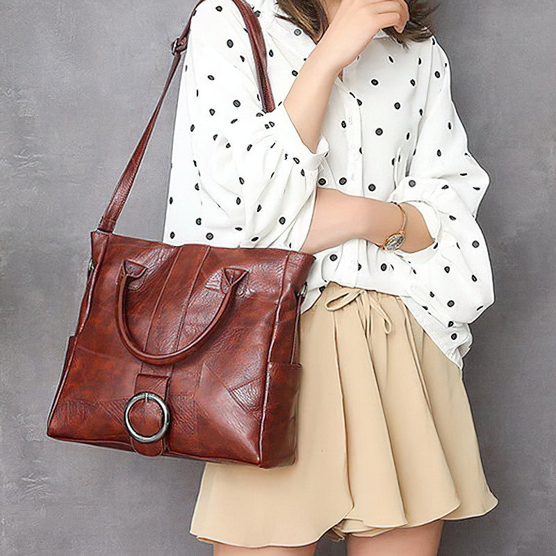 Stylish pu leather women's retro handbag in brown, featuring a ring decoration, perfect for travel and everyday use.