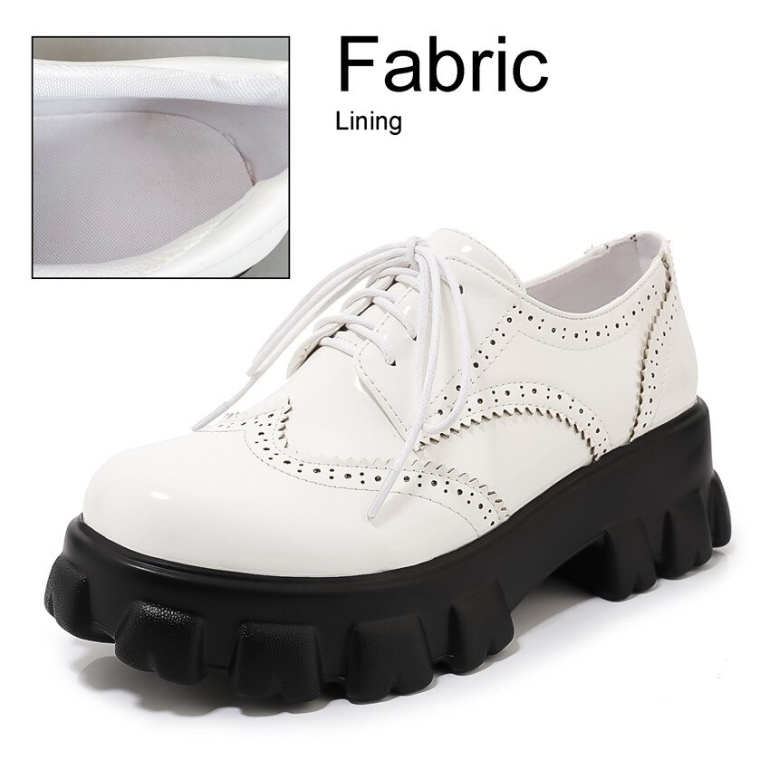 White PU leather platform women's shoes with square heel and round toe, featuring stylish laces and edgy design.