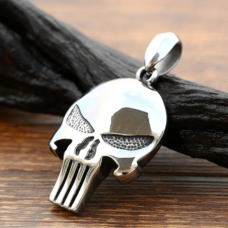 Stylish stainless steel Punisher skull pendant on a wooden background, perfect for unisex rock style jewelry.
