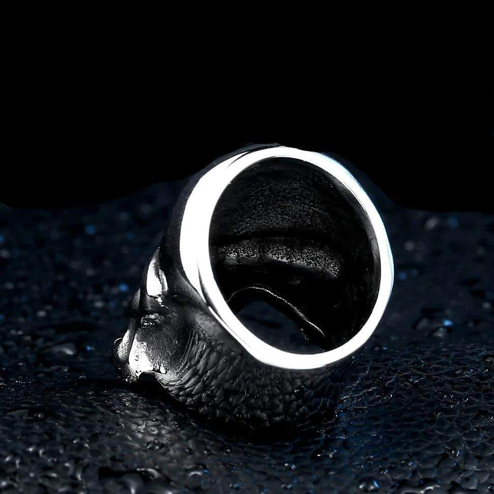 Punisher Skull Ring made of polished stainless steel on a textured surface, perfect for rock style fashion enthusiasts.