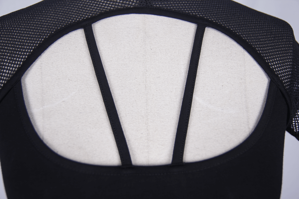 Back view of black gothic t-shirt with mesh insert and stylish straps for women.