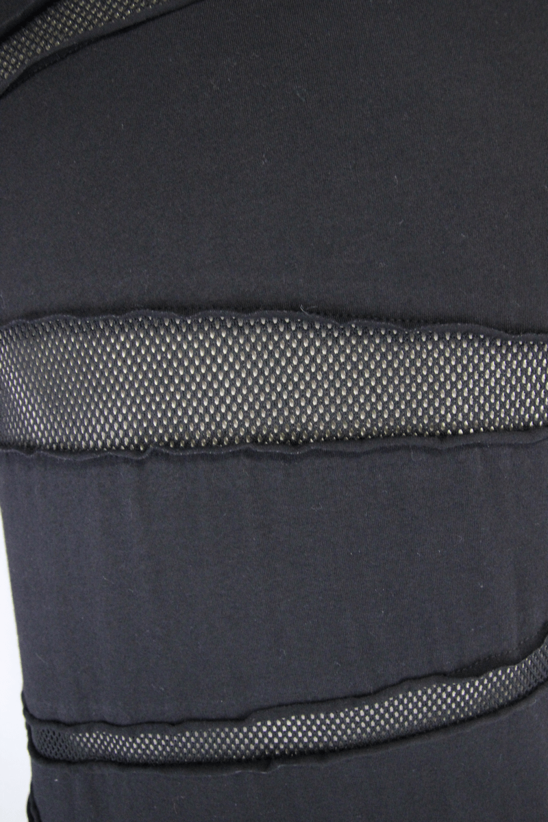 Close-up of men's black punk t-shirt showcasing mesh panels and creative design for a stylish casual look.