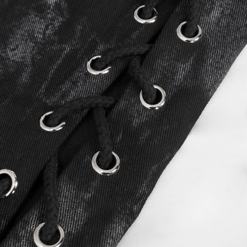 Close-up of black waistcoat lacing with silver eyelets, showcasing punk style and trendy design details.