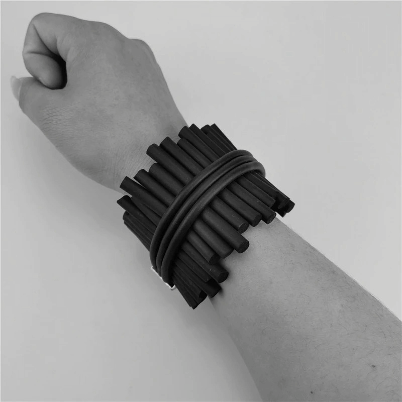 Stylish women's punk black wide bracelet made of rubber, perfect for completing your rock-inspired outfits.
