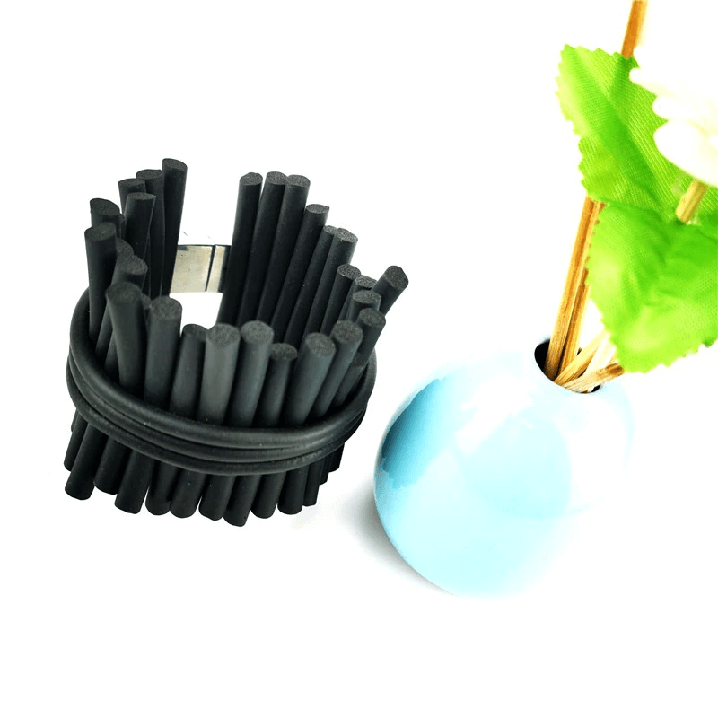 Handmade punk black rubber wide bracelet next to a blue vase with flowers, perfect for stylish outfits.