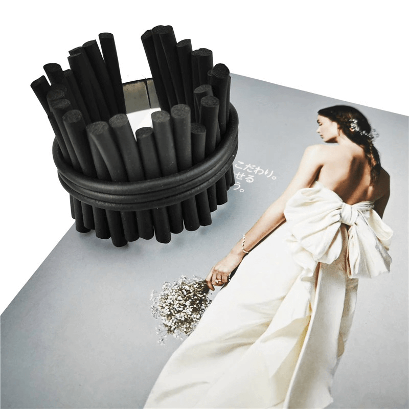 Handmade black rubber wide bracelet displayed on a fashion magazine, showcasing punk style jewelry for women.