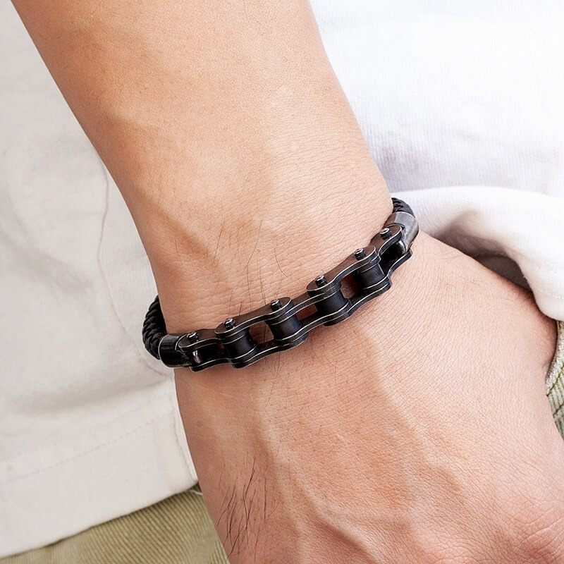 Stylish men's punk leather bracelet with black stainless steel chain design on wrist.