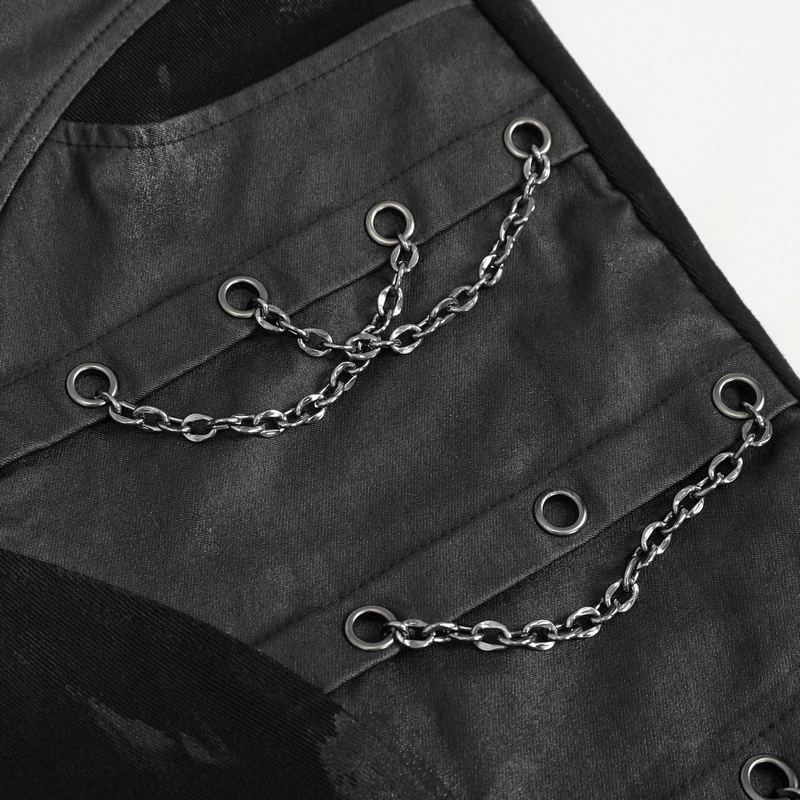 Detail of black punk pants with silver chain accents and buckle straps, showcasing gothic style fashion.