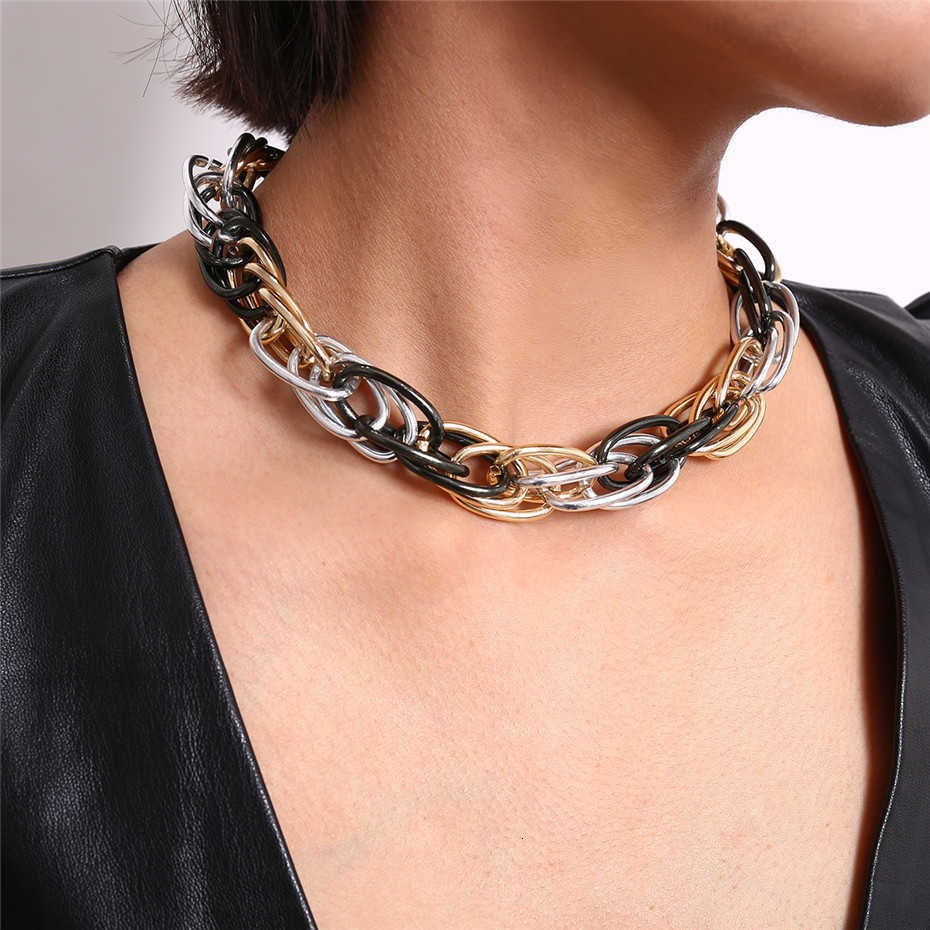 Stylish punk curb Cuban twisted necklace in mixed colors worn by model, showcasing unisex jewelry for bold outfits.