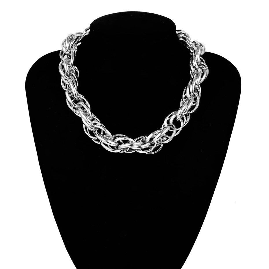 Massive punk curb Cuban twisted necklace displayed on black bust, perfect unisex jewelry for stylish outfits.
