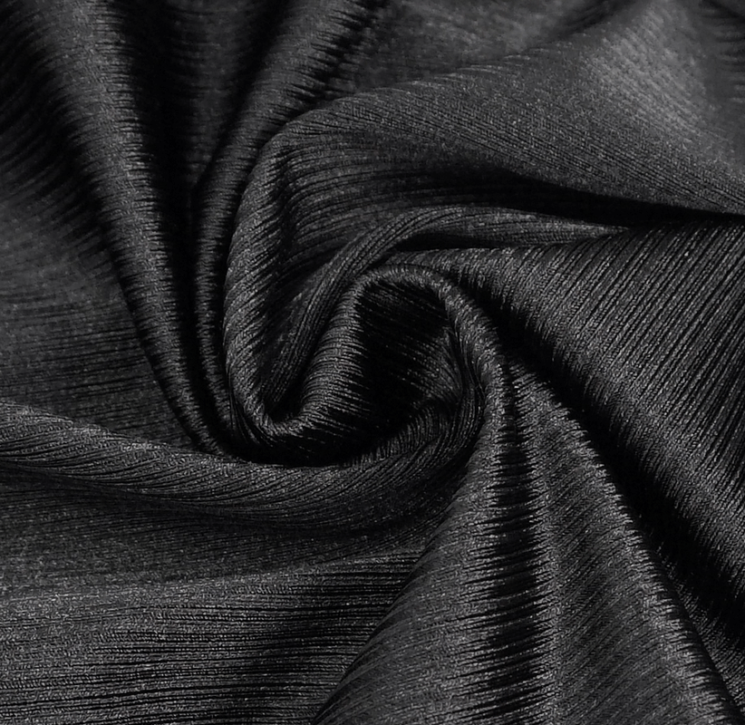 Luxurious black fabric swirl, perfect for crafting stylish punk one-piece swimsuits or modern fashion pieces.
