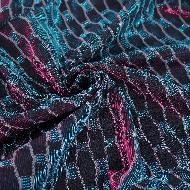 Close-up of vibrant punk style fabric featuring intricate patterns in blue and pink hues, ideal for trendy short tops.