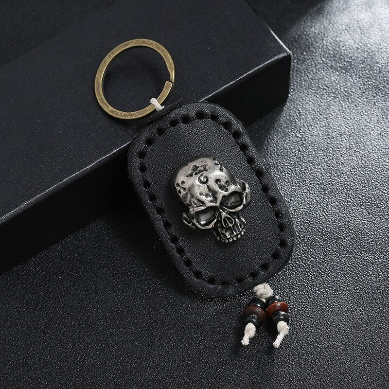 Punk genuine leather keychain featuring a silver skull pendant, perfect for men and women as a stylish accessory.