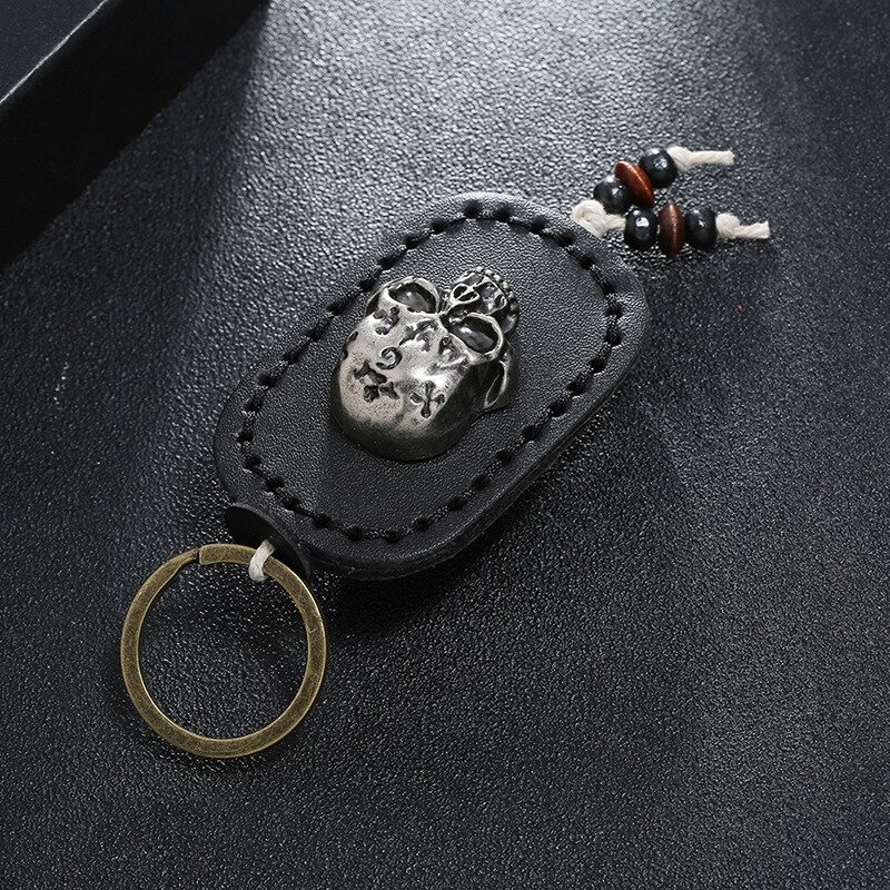 Punk genuine leather keychain with silver skull pendant and decorative beads, perfect for men and women.